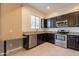 Modern kitchen featuring stainless steel appliances, granite countertops, and tiled flooring at 1367 S Country Club Dr # 1276, Mesa, AZ 85210