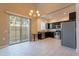 Open-concept kitchen with stainless steel appliances, granite countertops, and convenient breakfast bar at 1367 S Country Club Dr # 1276, Mesa, AZ 85210