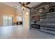 Open living room with feature wall, fireplace, and view into the kitchen and backyard at 1367 S Country Club Dr # 1276, Mesa, AZ 85210