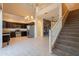 Open floor plan showcasing the kitchen, living area, and staircase with modern finishes at 1367 S Country Club Dr # 1276, Mesa, AZ 85210