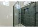 Modern shower with glass door and matte black hardware and fixtures at 1367 S Country Club Dr # 1276, Mesa, AZ 85210