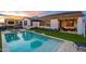 Enjoy outdoor living with a private pool, artificial turf, and an outdoor kitchen area at 13941 W Tierra Grande --, Surprise, AZ 85387