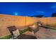 Cozy patio with comfortable lounge chairs and a fire pit, perfect for evening relaxation at 13941 W Tierra Grande --, Surprise, AZ 85387