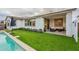 Beautiful backyard pool, outdoor seating, and lush turf, perfect for entertaining at 13941 W Tierra Grande --, Surprise, AZ 85387