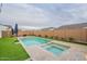 Relaxing backyard pool and spa with turf lawn, and a privacy fence surround at 13941 W Tierra Grande --, Surprise, AZ 85387