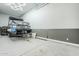 Spacious three-car garage with epoxy flooring at 13941 W Tierra Grande --, Surprise, AZ 85387
