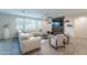 An open living room features a large sectional sofa, a ceiling fan, and decorative elements at 13941 W Tierra Grande --, Surprise, AZ 85387
