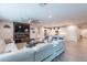 Open concept design with fireplace and TV feature wall, with kitchen and living areas at 13941 W Tierra Grande --, Surprise, AZ 85387