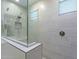 Modern shower featuring neutral tile, glass door, and built-in niche for toiletries at 13941 W Tierra Grande --, Surprise, AZ 85387
