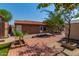 Backyard area with mature landscaping, and wooden deck at 1448 E Royal Palm Rd, Phoenix, AZ 85020