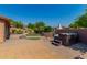 Backyard with a putting green, a fire pit, a hot tub, and desert landscaping at 1448 E Royal Palm Rd, Phoenix, AZ 85020
