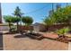 Well-maintained backyard features palm trees, a shed, and brick pavers at 1448 E Royal Palm Rd, Phoenix, AZ 85020