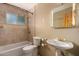 Bathroom with a single sink vanity and a shower and bathtub combination at 1448 E Royal Palm Rd, Phoenix, AZ 85020