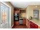 Compact kitchen featuring stainless steel appliances, breakfast bar and ample counter space at 1448 E Royal Palm Rd, Phoenix, AZ 85020
