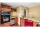 Compact kitchen featuring stainless steel appliances, wine rack and breakfast bar at 1448 E Royal Palm Rd, Phoenix, AZ 85020