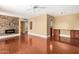 Spacious living room features hardwood floors, modern fireplace, and custom built-in storage cabinets at 1448 E Royal Palm Rd, Phoenix, AZ 85020