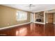 Open living room with hardwood floors, fireplace and large windows at 1448 E Royal Palm Rd, Phoenix, AZ 85020