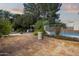 Spacious tiled backyard featuring a fire pit, gazebo, pool, and mature landscaping at 1522 W Myrtle Ave, Phoenix, AZ 85021