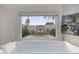 Bathroom view from tub overlooks lush garden landscape with fountain at 1522 W Myrtle Ave, Phoenix, AZ 85021