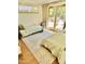 Bedroom with two beds and access to the outdoors through glass doors at 1522 W Myrtle Ave, Phoenix, AZ 85021