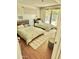 Bedroom with two beds and access to the outdoors through glass doors at 1522 W Myrtle Ave, Phoenix, AZ 85021