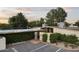 Inviting entrance showcasing a well-lit doorway, lush greenery, and a private driveway at 1522 W Myrtle Ave, Phoenix, AZ 85021