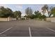 Ample parking space with marked stalls, lush greenery, and a well-maintained exterior at 1522 W Myrtle Ave, Phoenix, AZ 85021