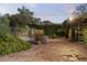Tiled backyard patio surrounded by lush greenery offering private outdoor space at 1522 W Myrtle Ave, Phoenix, AZ 85021