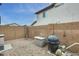 Backyard with storage shed, gravel landscaping, and privacy fencing for outdoor enjoyment at 15962 W Statler St, Surprise, AZ 85374