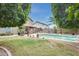 Wonderful backyard featuring a covered patio, built-in barbecue, and a refreshing swimming pool at 15962 W Statler St, Surprise, AZ 85374
