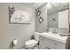 Well-lit bathroom featuring modern vanity, artwork and neutral paint at 15962 W Statler St, Surprise, AZ 85374