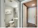 Bathroom showcasing neutral paint, a modern vanity and decorative diamond-shaped mirrors at 15962 W Statler St, Surprise, AZ 85374