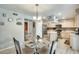 Bright breakfast nook featuring a kitchen, pantry and decorative signs at 15962 W Statler St, Surprise, AZ 85374