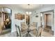 Bright breakfast nook adjacent to the living room and access to a bathroom at 15962 W Statler St, Surprise, AZ 85374