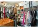 Walk-in closet with organized shelves, hanging clothes, and ample storage space at 15962 W Statler St, Surprise, AZ 85374