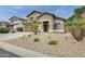 Beautiful two-story home featuring desert landscaping, attached garage, and covered entryway at 15962 W Statler St, Surprise, AZ 85374