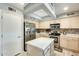 Well-equipped kitchen with ample counter space, stainless steel appliances, and an island and ample storage at 15962 W Statler St, Surprise, AZ 85374