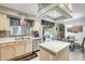 Bright kitchen featuring stainless steel appliances, an island and a breakfast nook that opens onto the backyard patio at 15962 W Statler St, Surprise, AZ 85374