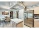 Bright kitchen featuring stainless steel appliances, an island and a breakfast nook at 15962 W Statler St, Surprise, AZ 85374
