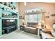 Comfortable living room featuring a coffered ceiling and large windows at 15962 W Statler St, Surprise, AZ 85374