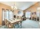Open-concept living space with dining area, living room, and plenty of natural light and vaulted ceilings at 15962 W Statler St, Surprise, AZ 85374