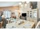 Open floor plan showcases a dining area flowing into a comfortable living space and vaulted ceilings at 15962 W Statler St, Surprise, AZ 85374