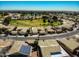 An aerial view of a planned community featuring well-maintained homes and green spaces at 17514 N Rainbow Cir, Surprise, AZ 85374