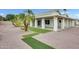 A pristine backyard featuring a covered patio, decorative gravel, and stylish turf accents at 17514 N Rainbow Cir, Surprise, AZ 85374