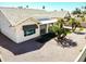 Image of backyard with desert landscaping, covered patio, and bright exterior paint at 17514 N Rainbow Cir, Surprise, AZ 85374