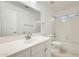 Bathroom with white vanity and shower over bath at 17514 N Rainbow Cir, Surprise, AZ 85374