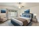 Serene bedroom featuring a comfortable bed, soft natural light, and neutral tones for a relaxing atmosphere at 17514 N Rainbow Cir, Surprise, AZ 85374