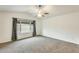 Bedroom with carpet and large window at 17514 N Rainbow Cir, Surprise, AZ 85374