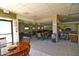 Inviting common area with multiple tables and chairs plus comfortable seating, ideal for community gatherings and events at 17514 N Rainbow Cir, Surprise, AZ 85374