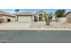 Charming single-story home with a well-maintained front yard and a two-car garage in a desirable neighborhood at 17514 N Rainbow Cir, Surprise, AZ 85374